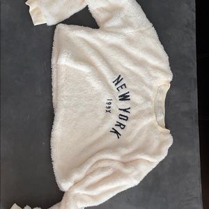 New York cropped fur long sleeve top